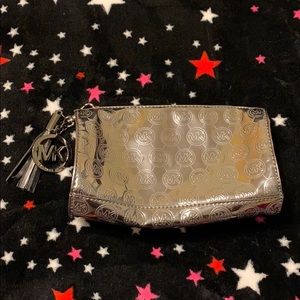 Michael Kors Bags - Michael Kors silver metallic pouch Michael Kors Bags - Michael Kors silver metallic pouch